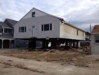 Ortley Beach, NJ – a house pushed into the neighbor’s house, moved back into it’s lot.