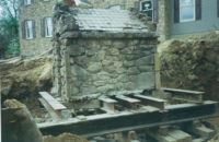 Historic well house moved to make way for new homes.